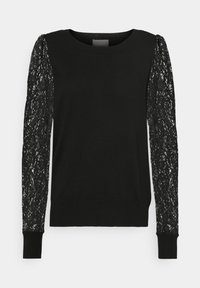 Melnas džemperis ar garām mežģīņu piedurknēm, kurās ir ziedu raksts. Vienotā krāsa ķermenī, ribotas piedurknes un apakšmalas, apaļa izgriezums. Gluda tekstūra.