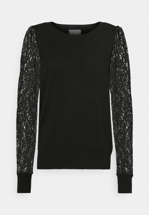 Sort sweater med lange blondeærmer med blomstermønster. Hel kropsdel med ribbede manchetter og kant, rund halsudskæring. Glat tekstur.