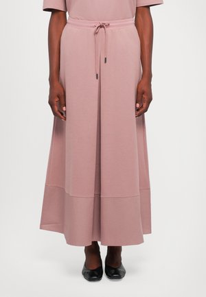 Maxirock aus weichem pinkfarbenem Jersey-Stoff mit lockerer Passform, elastischem Taillenbund, Kordelzug und Nahtdetails am Saum. Rundliche Silhouette.