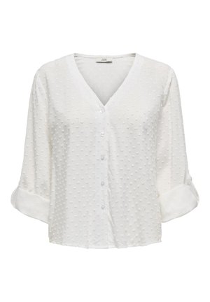 White, short-sleeve blouse with a V-neck, featuring textured dot patterns throughout and button closures along the front.