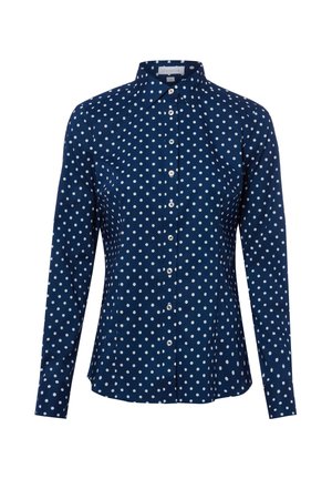 Chemise bleu marine à manches longues avec boutons, à pois blancs et col pointu.