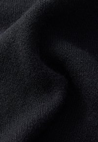 Black fabric with a soft, textured weave, featuring a slight sheen and fine, fuzzy fibers throughout. No visible patterns or accents.