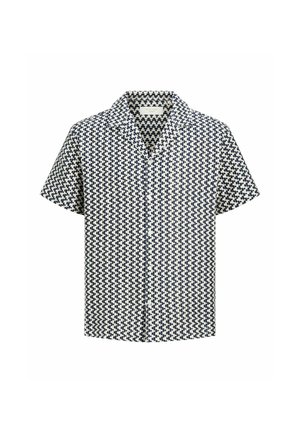 Chemise à manches courtes avec motif géométrique noir et blanc et col ouvert.
