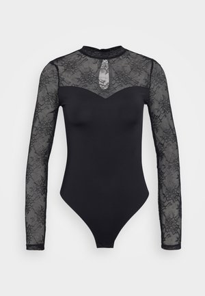 Must mustress, mille long sheer pitsakäistega, ümmarguse kaeluse ja esiplaanil oleva võtmeaugu detailiga. Sile tekstuur ja elastne istuvus.