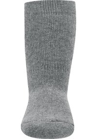 Calzino in misto cotone grigio con bordo a coste, punta senza cuciture e texture liscia, progettato per comfort e calore.