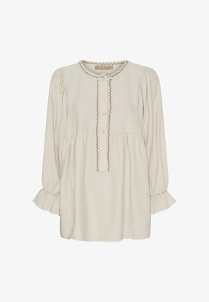 Lys beige langærmet bluse med rund halsudskæring, knaplukning og broderede detaljer ned ad fronten og ved ærmekanterne.
