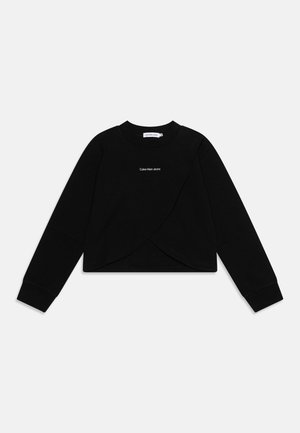 Sort cropped sweatshirt med lange ærmer og overlappende frontpaneler med "Calvin Klein Jeans" logo centreret på brystet.