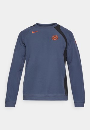 Marineblaues Sweatshirt mit Rundhalsausschnitt, ausgestattet mit schwarzen Seitenpanelen, einem orangefarbenen Nike-Logo auf der Brust und elastischen Bündchen und Saum.