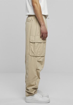 Karl Kani RUBBER SIGNATURE PANTS UNISEX - Cargo trousers - beige