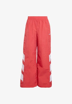 Rote, weit geschnittene Sporthose aus leichtem Material, mit weißen Seitenstreifen und elastischem Bund.