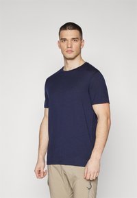 Navy blue short-sleeve T-shirt made of soft material, featuring a round neckline and a relaxed fit. Simple design with no patterns.