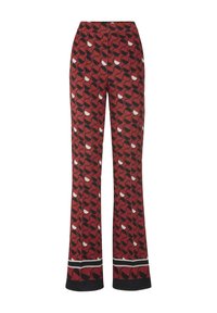 Rode broek met een opvallend cirkelpatroon in zwart en wit, met een platte tailleband en een wijd beenontwerp.