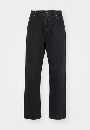 Musta farkkuhousut suoranlahkeisella leikkauksella, jossa on normaali vyötärö, viisi taskua ja hillityt ompeluyksityiskohdat.