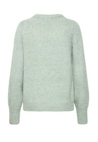 Suéter de punto verde claro con cuello redondo, mangas largas y una textura suave con un corte holgado. La vista trasera muestra puños y dobladillo acanalado.