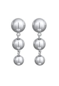Boucles d'oreilles en métal argenté comportant trois éléments sphériques de tailles variées, avec une finition polie et réfléchissante.
