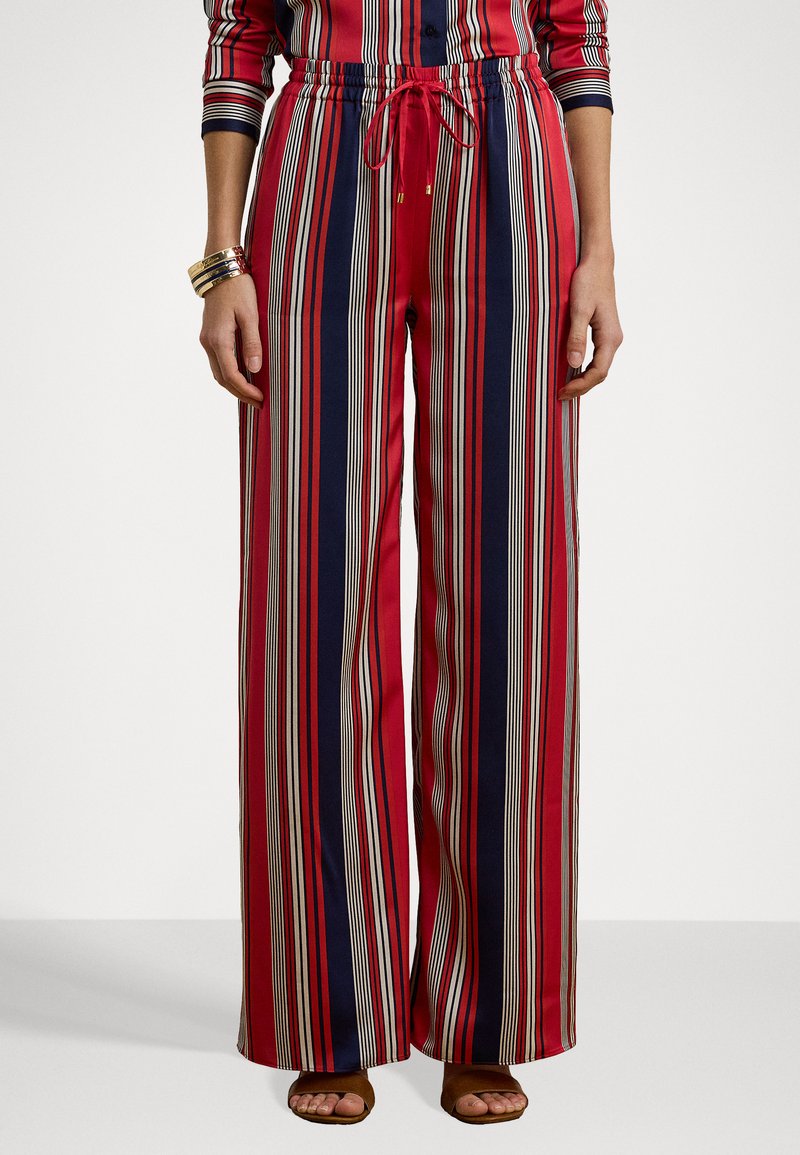 Red and navy striped wide-leg pants with an elastic waistband and drawstring, featuring thin off-white vertical lines.