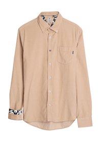 Lange mouwen knoopshirt van lichtbeige stof, met een borstzak en een gestructureerde manchet met een marineblauw en witte bloemmotief.
