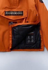 Orange waterproof jacket with a black insulated lining and interior pocket. Features branded logo, with labels indicating water resistance and breathability.