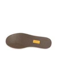 Semelle de chaussure en caoutchouc brun avec un motif de bande de zigzag et un contour blanc. Présente une étiquette jaune rectangulaire au centre.