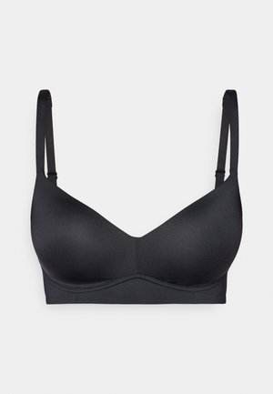 Black wireless bra with adjustable straps, seamless cups, V-neck design, and smooth texture. Simple, functional design without embellishments.