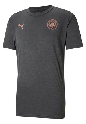 Ciemnoszara koszulka Manchester City z różowo-złotym logo Puma i herbem klubu na piersi, z okrągłym dekoltem i krótkimi rękawami.