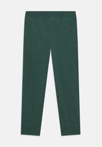 Groene katoen leggings met een elastische tailleband en aansluitende boorden bij de enkels. Eenvoudig ontwerp zonder extra patronen of versieringen.