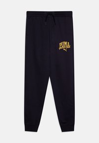 Navy sweatpants with tapered legs, elastic waistband, and adjustable drawstring. Gold "PUMA sports club" logo featured on the front.