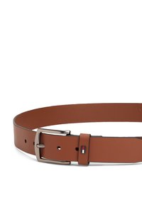 Brown synthetic leather belt with a silver metal buckle, featuring a logo accent in red, white, and blue. Smooth texture and adjustable length.