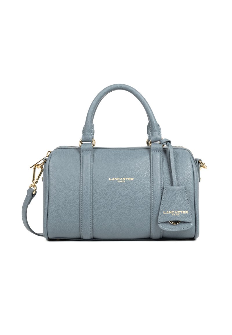 Blauwe leren Lancaster handtas met twee handvaten, afneembare schouderriem, gouden hardware en een geperst logo van het merk aan de voorkant en het label.