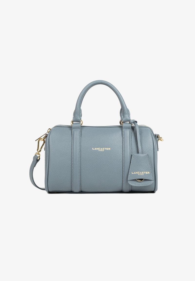 Blauwe leren Lancaster handtas met twee handvaten, afneembare schouderriem, gouden hardware en een geperst logo van het merk aan de voorkant en het label.