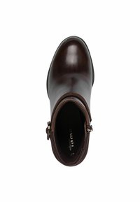 Bottine en cuir marron avec une finition lisse, bout rond et détail de boucle sur le côté. Intérieur doublé de tissu doux pour plus de confort.