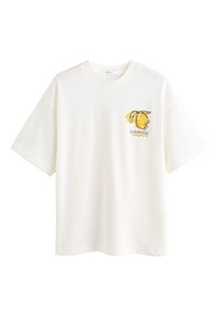 T-shirt en coton blanc à manches courtes et col rond. Présente un motif jaune de citrons et le mot « LIMONADA » sur la poitrine.