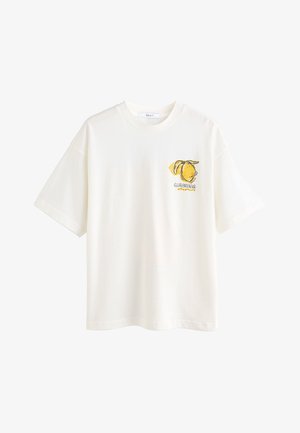 Weißes Baumwoll-T-Shirt mit kurzen Ärmeln und Rundhalsausschnitt. Auf der Brust befindet sich eine gelbe Grafik von Zitronen und das Wort "LIMONADA".