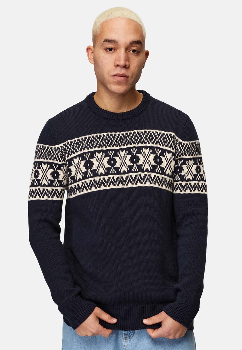 Navy knitted sweater with a light beige Nordic pattern across the chest. Features a crew neckline and ribbed cuffs and hem.