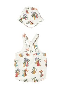 Mono de algodón y sombrero de cubo a juego, ambos en blanco con estampado colorido de palmeras y loros. Cuenta con tirantes cruzados y una correa ajustable para la barbilla.