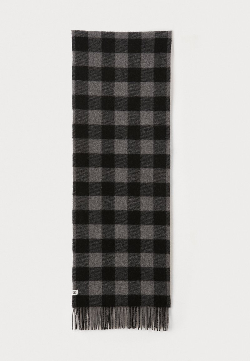 Black and gray checkered scarf with a soft texture, featuring fringed ends and a rectangular shape. Made from warm fabric.