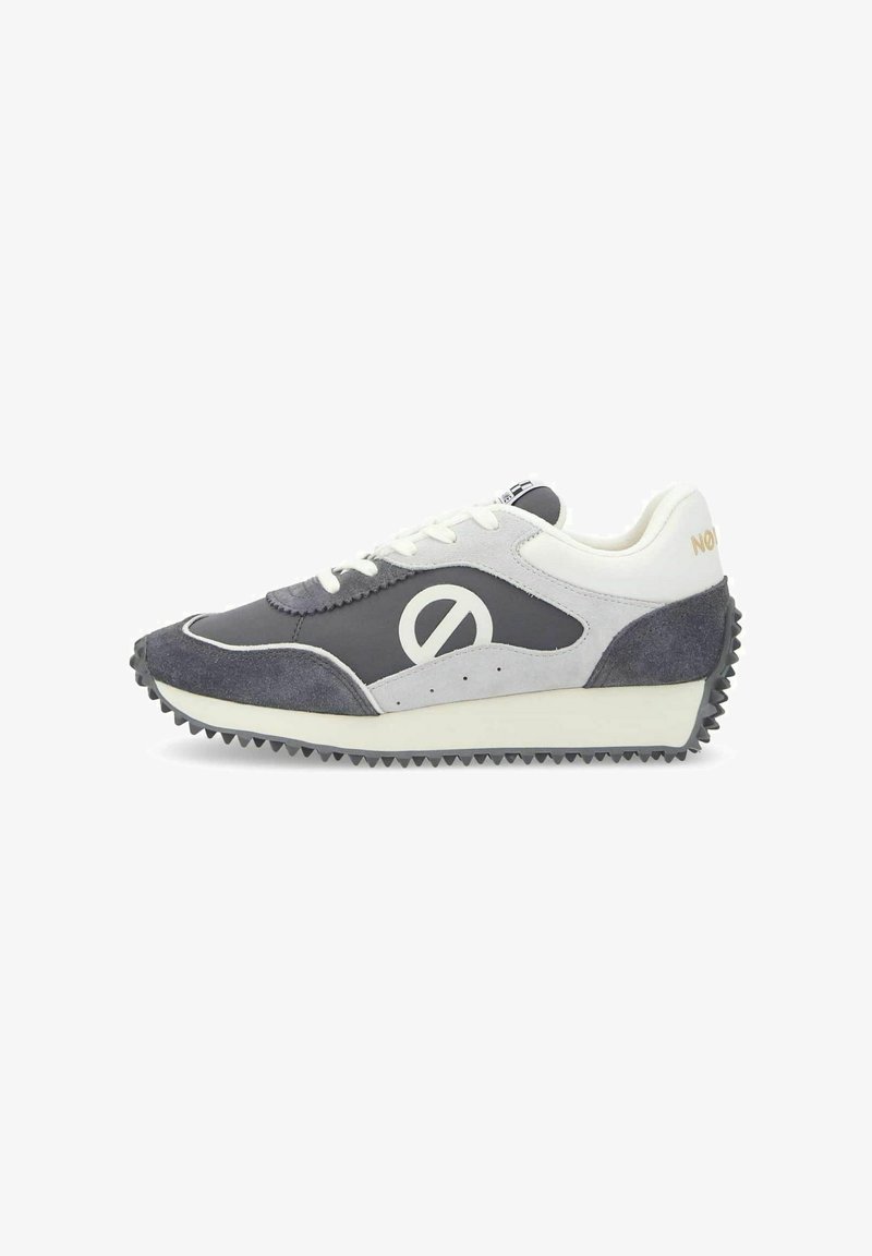 Black and gray sneaker with suede and mesh panels, rounded toe, white accents, and textured rubber outsole. Features contrasting logo detail.