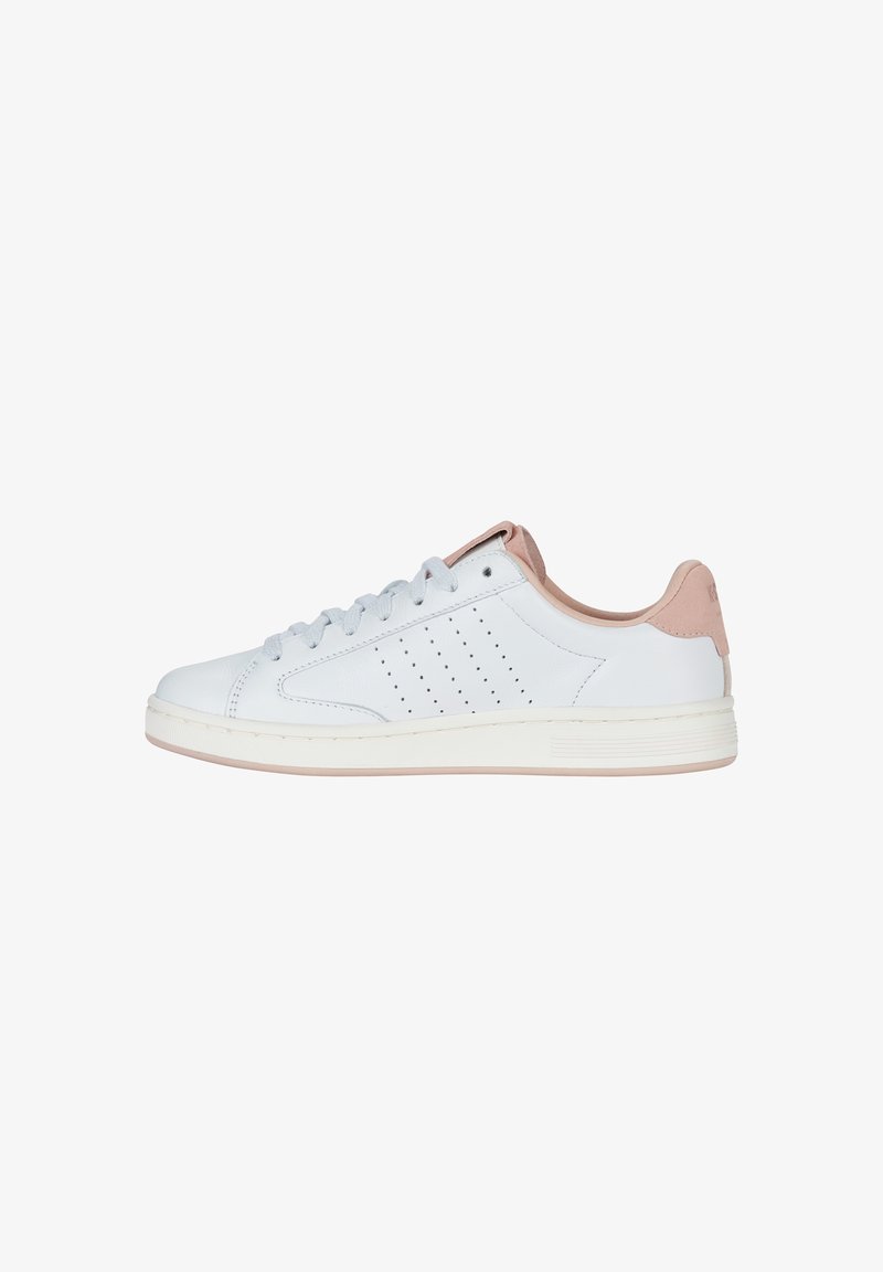White leather sneaker with a pink suede heel accent, perforated side detail, grey laces, and a white rubber sole.