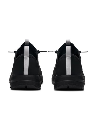 Black athletic shoes with a sleek design, featuring a textured upper, padded collar, and a contrasting gray pull tab at the heel.