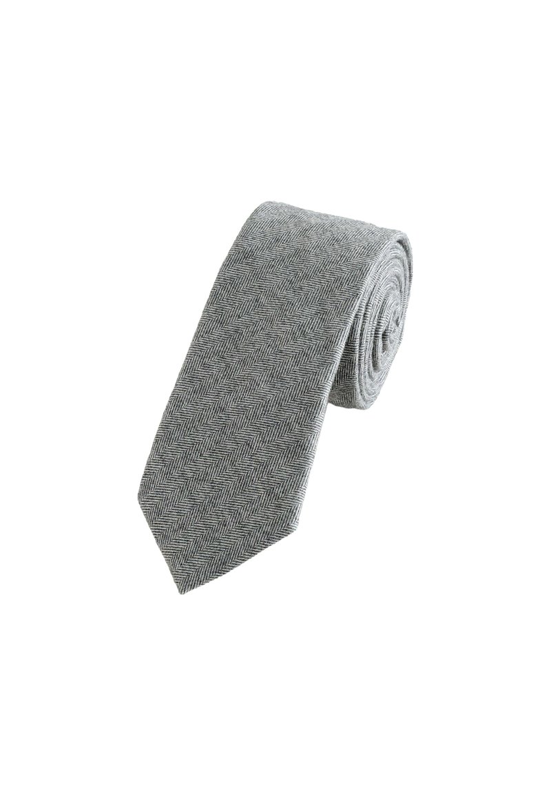 Hall herringbone seot, millel on tekstuurne kudumine, terav ots ja peened diagonaalsed mustrid kogu kanga ulatuses.