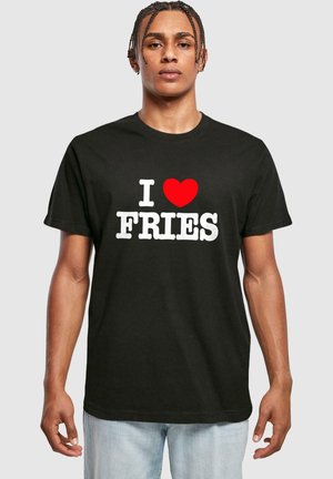 Sort t-shirt med fed hvid tekst "I ♥ FRIES" med et rødt hjerte. Korte ærmer, rund halsudskæring, lavet af blødt stof.
