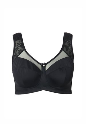 Reggiseno nero con pannelli in tulle trasparente e dettagli in pizzo. Presenta un design strutturato, spalline larghe e un fiocco decorativo frontale.