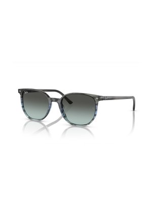 Occhiali da sole con gradiente grigio e blu, forma della lente rotonda, montatura trasparente e logo Ray-Ban discreto sui lati.