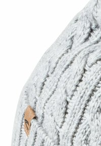 Knit winter hat in light gray with a textured cable pattern. Features a small brown leather tag on the side.