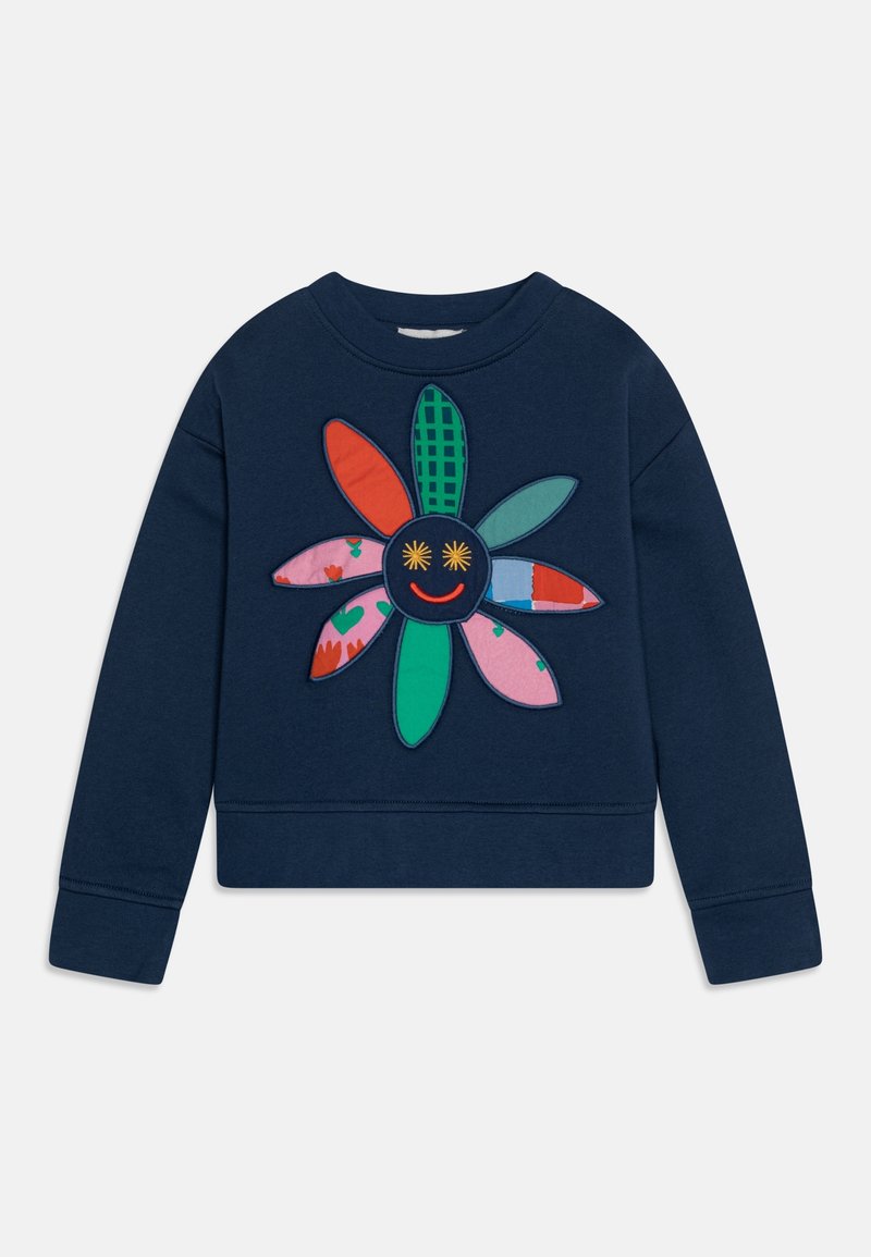 Sweat-shirt bleu marine avec un motif floral coloré comprenant des pétales à motifs et un visage souriant avec des yeux en forme d'étoile au centre.