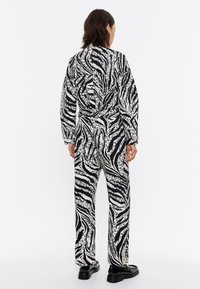 Bimba Y Lola Mono - zebra marfil