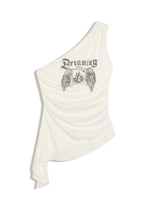 Haut blanc asymétrique à une épaule avec un graphisme noir représentant des ailes, un bouclier de château et le texte « Rêver de mon château gothique » sur le devant.