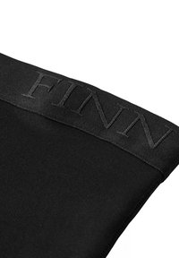 Black garment with a smooth texture, featuring a wide waistband embossed with the word "FINN" in a darker shade of black.