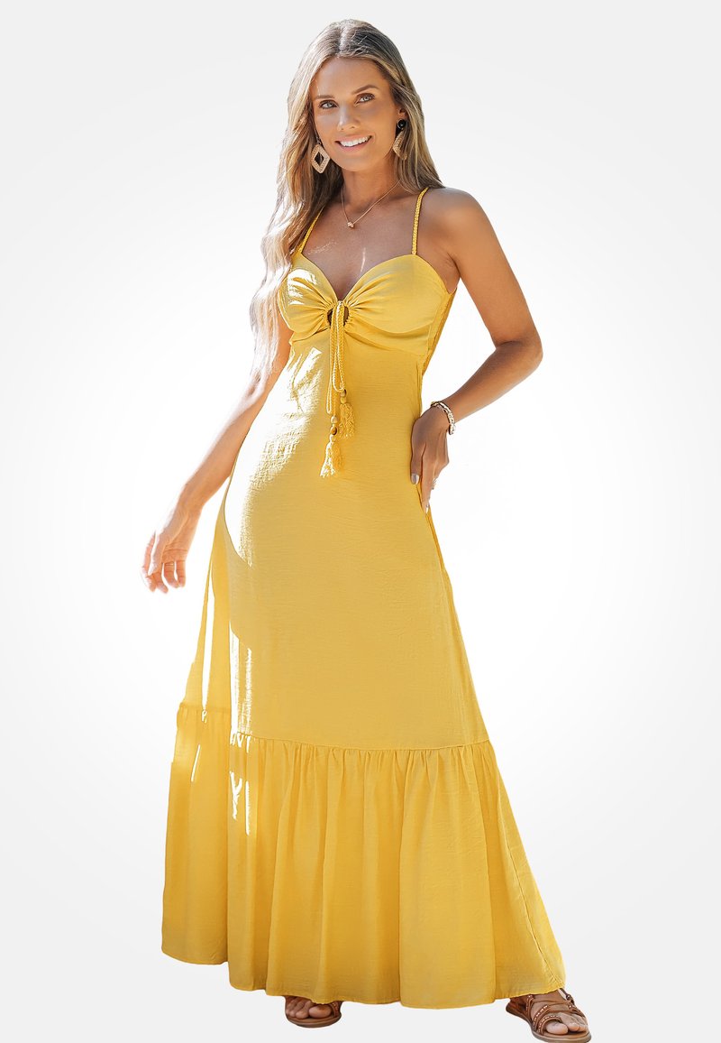 Gelbes Maxikleid mit einem figurbetonten Oberteil, gerafften Details, verstellbaren Spaghetti-Trägern und einem mehrlagigen Rüschensaum. Aus leichtem Material gefertigt.