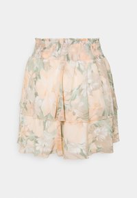 Jupe mini florale avec taille smockée, design superposé, présentant des couleurs pastel pêche et verte, et une texture légère et transparente.